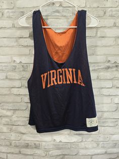 University of Virginia College Sleeveless Shirt Blue Reversible Mesh Jersey Size Large Measures 22" Length x 46" Chest Casual Sleeveless Tank Top For College, Collegiate Sleeveless Top For Streetwear, Collegiate Cotton Sleeveless Tank Top, Collegiate Sleeveless Cotton Tank Top, Cotton Sleeveless Collegiate Tank Top, Collegiate Sleeveless Cotton Top, Sporty Sleeveless Tops For College, Navy Stretch Tank Top, Sleeveless Tops For College Summer