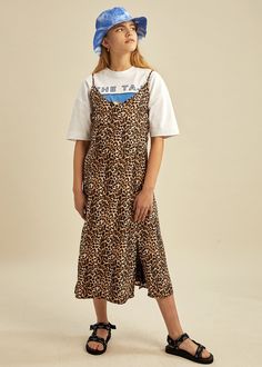 One of our favorites this season: A beautiful strappy v-neck dress with side-slits in leopard print, made in a tencel twill quality. Can be worn over a t-shirt for an edgy look. 100% Tencel Big Backpacks, Festival Crop Tops, Twill Dress, Sports Crop Tops, Leopard Skirt, Color Block Leggings, Children's Boutique, Kids Boutique, Spring Summer Dress