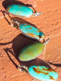 Beautiful Kingman turquoise, sterling silver bezel set with fine Native stamping. Striving for attention to detail, we finish these with a large 3/4 inch hammered bail. Available in many varieties of Kingman turquoise ranging from brilliant green to powder blue. Shown in our favorite Red matrix and blue. Stones are around 3 by 2. These look great with our kangaroo leather necklaces, or Navajo pearls! Artisan Turquoise Jewelry With Polished Finish, Blue Patina Sterling Silver Jewelry, Blue Sterling Silver Jewelry With Patina, Kingman Turquoise, Drop Pendant, Powder Blue, Leather Necklace, Bezel Setting, Turquoise Jewelry