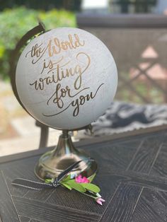 a white globe sitting on top of a table