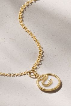 The snake on Foundrae's necklace holds so much meaning - it represents wholeness and is known as a "talisman of rejuvenation - they shed their skin to grow, just as we need continued growth to find balance." It's handmade from 18-karat gold and inlaid with glossy white enamel and a single diamond. Wear it layered with other symbolic styles from the brand. Luxury Yellow Gold Snake Necklace, White Snake Chain Necklace With Adjustable Chain, Symbolic Gold Snake Jewelry, Spiritual Gold Snake Necklace, Symbolic White Medallion Necklace, White Luxury Necklace With Box Chain, White Luxury Box Chain Necklace, Luxury White Box Chain Necklace, Elegant Yellow Gold Snake Necklace