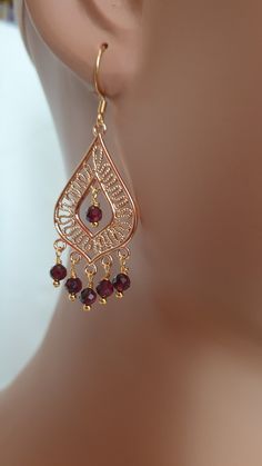 This earrings are made with natural Garnet beads (4mm), gold plated chandelier link and gold plated headpins.  The length of the earrings including the hooks are approximately 6 cm. Please note the only hooks are available in gold plated and gold filled the rest of the earrings are made with gold plated brass. Please contact me in case you have any questions. Gold Beaded Dangle Earrings With French Hook, Gold Beaded Earrings With French Hook As Gift, Elegant Beaded Earrings With French Hook As Gift, Gold-plated Dangling Bead Earrings, Gold-plated Earrings With Dangling Beads, Gold Dangle Chandelier Earrings With Beads, Elegant Beaded Drop Earrings With French Hook, Gold Chandelier Dangle Earrings With Beads, Gold Plated Dangling Beads Earrings