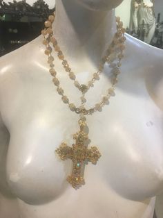 Can be worn multi ways. Has a clasp so that you can wrap it around and wear it as a choker or a shorter necklace. 24k gold plated. This is truly a beautiful piece. Pictures do not do justice . Big Cross Necklace Outfit, Gold Jewelry Pale Skin, Gold Crystal Cross Necklace, Gold Cross Crystal Necklace, Gold Cross Necklace With Crystal, Gold Multi-strand Crystal Party Necklaces, Gold Multi-strand Crystal Necklace For Party, Gold Multi-strand Crystal Party Necklace, Gold Spiritual Crystal Choker Necklace