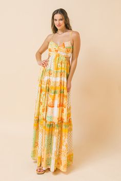 A printed maxi dress featuring plunging V neckline, side cut-out and a tiered skirt. Details Self: 100% Polyester Lining: 100% Polyester Size & Fit - Model is 5`8" And Wearing Size Small - Measurements Taken From Size Small - Approx. Length: 51" Yellow Printed Maxi Dress For Party, Orange Maxi Dress For Brunch, Yellow Printed V-neck Maxi Dress, Yellow Floor-length Maxi Dress For Spring, Yellow Maxi Dress For Brunch, Yellow V-neck Maxi Dress For Vacation, Printed Yellow Maxi Dress, Yellow Maxi Dress For Spring, Summer Yellow Printed Maxi Dress