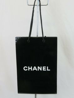 CHANEL BLACK GLOSS PAPER SHOPPING GIFT BAG FOR CLOTHES GIFTS ACCESSORIES  100% AUTHENTIC Color: BLACK White "CHANEL" logo on both side of a bag Size: VARIOUS NOTE: The colors of the products and the colors of the inscriptions on them  on the monitor screen may differ from the actual colors of the products and the colors of the inscriptions of them. NOTE!!!!! International Buyers: Import duties, taxes and charges are NOT included in the item price or shipping cost. These charges are the buyer's r Bag For Clothes, Chanel Logo, Black Gloss, Coach Horse And Carriage Tote, Chanel Black, Party Card, Gift Accessories, Clothes Gift, Gift Wrapping Supplies