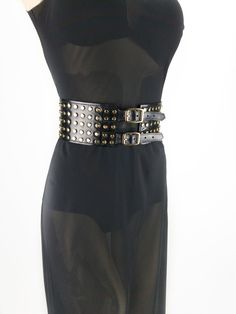 This 3in (8cm ) wide belt with metal buckles and gold metal studs is made of stiff calf leather with a gloss finish. With to its unique design, this belt will accentuate the waist and create a flattering feminine shape. This belt will fit many styles - Steampunk, Biker, Goth, Punk, Cowboy. You can wear this corset belt with dresses and blouses, it can even be worn over a cloak or jacket. Add this fashionable item to your wardrobe and you will not leave anyone indifferent! Other models of wide wa Punk Cowboy, Festival Cowgirl, Goth Belt, Cowgirl Belt, Steampunk Festival, Cowgirl Belts, Bling Belts, Waist Corset, Corset Belt