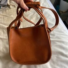 Brand New Madewell Purse. Shoulder Strap And Brass Hardware. Genuine Leather. Used Once. Tan Rectangular Bucket Bag With Detachable Strap, Tan Leather Bucket Shoulder Bag, Tan Leather Bucket Bag With Leather Handles, Tan Leather Bucket Bag For Daily Use, Cognac Rectangular Bucket Bag With Adjustable Strap, Rectangular Cognac Bucket Bag With Adjustable Strap, Leather Tan Bucket Bag With Removable Pouch, Tan Crossbody Bucket Bag With Removable Pouch, Leather Tan Bucket Bag For Errands