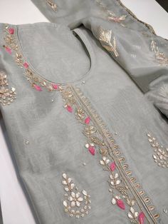 Item Overview ATHARVA Hand Embroidery Salwar Kameez/Grey/Chanderi Silk/Gota Pati Chiffon Chinon Dupatta/Custom Stitch Unstitch/Churridar/Anarkali/Gift/ Dno. CH1804 Fabric: * Shirt - Chanderi Silk- Hand Embroidered Neck 2.5 Mts - Beautiful Hand Embroidery * Dupatta: Chiffon Chinnon Dupatta- All over Exclusive Gota Patti Embroidery - 2.5 Mts- Latkans Tassels * Bottom Santoon Silk 2.5 Mts. Excusive Hand Embroidered Party Wear Punjabi Suit. Customization: * Fabrics Customization: Designs Can be made Embroidery On Grey Fabric, Designer Gray Set With Zari Work, Festive Gray Zari Work Sets, Gray Resham Embroidery Kurta For Wedding, Gray Anarkali Set With Zari Work, Gray Anarkali Set With Dupatta, Gray Festive Sets With Resham Embroidery, Gray Anarkali Set For Festive Occasions, Festive Embroidered Gray Sets