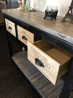 a table with two drawers on it and an eiffel tower in the background