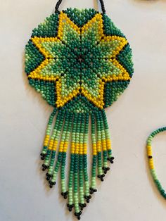 Beautiful limited Huichol necklace. Traditional Green Adjustable Necklace, Unique Beaded Medallion Necklace, Handmade Green Beaded Necklaces For Festivals, Unique Green Necklaces For Festivals, Unique Green Necklace For Festivals, Unique Green Necklace For Festival, Green Spiritual Necklace For Festivals, Green Spiritual Necklace For Festival, Handmade Multicolor Beaded Medallion Necklaces