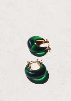 Introducing our enchanting A Thousand Island Earrings - a mesmerising homage to the lush beauty of nature, crafted with the finest deep green emerald. These curve-shaped earrings with mini gold hoops are wearable treasures inspired by the verdant islands, the tranquillity of a hidden paradise, and the timeless allure of nature's wonders. Material: Stainless Steel Waterproof: Yes Hypoallergenic: Suitable for sensitive skin Durability: Non-tarnish Each of our products is beautifully packaged in an elegant, reusable, and recyclable jewellery box, ready for gifting. Modern Green Round Earrings, Modern Green Handmade Jewelry, Green Handmade Modern Jewelry, Modern Handmade Green Jewelry, Handmade Modern Green Jewelry, Green Earrings For May Birthstone, Green Round Earrings For May Birthstone, Everyday Green Teardrop Hoop Earrings, Green Teardrop Hoop Earrings For Everyday