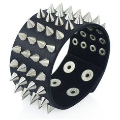 Four Row Spiked Metal Cuff. Black faux leather heavy metal clasp cuff wristband with four rows of spikes. A classic punk/metal accessory for any gender. Length: 22.5cm/8.9" Width: 4cm/1.6" Adjustable clasp closure. Spike Bracelet, Gothic Bracelet, Black Bangle, Faux Leather Bracelets, Bracelet Viking, Leather Bangle, Goth Jewelry, Gothic Rock, Wristband Bracelet