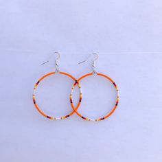 These beautiful hoop earrings come in different colors. They are made out of seed beads. If there is a color sold out just message us as we may have more or if you have any other questions. Thanks for looking at our page. We also have some clearance items or raffles on are Facebook group pages. Come check us out at Cassy's Native Selling & Auctions or Cassy's Native Beadwork & Apparels. Orange Hoop Earrings With Colorful Beads, Orange Hoop Beaded Earrings As Gift, Orange Beaded Hoop Earrings As A Gift, Orange Beaded Hoop Earrings For Gift, Orange Small Hoop Earrings With Ear Wire, Nickel-free Orange Hoop Earrings, Handmade Orange Hoop Earrings, Orange Beaded Hoop Earrings, Orange Hoop Earrings With Colorful Beads For Gift