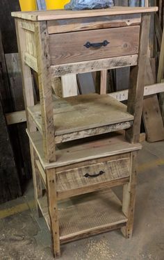 an old wooden chair with two drawers on it