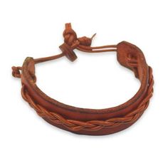 This simple but attractive bracelet for men is crafted by Gill Quarcoopome in Ghana. The artisan crafts the wristband from warm tan leather accented by a braided cord of leather in a slightly lighter shade. The casual bracelet is secured with a leather button clasp. Adjustable Brown Bracelet, Adjustable Brown Bracelets For Everyday Use, Adjustable Brown Braided Bracelet For Everyday Use, Adjustable Vintage Bracelets, Classic Handmade Adjustable Leather Bracelet, Classic Adjustable Brown Bracelets, Classic Adjustable Leather Bracelet With Waxed Finish, Vintage Adjustable Brown Braided Bracelets, Adjustable Brown Wristband For Everyday Use