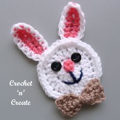 a crocheted bunny with a bow tie on it's head and eyes