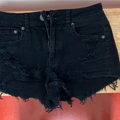 Black Distressed Denim Shorts Never Worn Perfect Condition Edgy Ripped Cotton Shorts, Black Ripped Cotton Jean Shorts, Distressed Black Cotton Jean Shorts, Black Distressed Cotton Jean Shorts, Black Cutoff Grunge Jean Shorts, Black Cutoff Jean Shorts Grunge Style, Black Cutoff Jean Shorts In Grunge Style, Ripped Cotton Jean Shorts Grunge Style, Grunge Ripped Cotton Jean Shorts