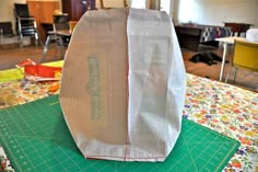 a paper bag sitting on top of a cutting board