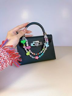 This super cute mini bag charm looks like adorable colorful candy. What's special about it is that although it's small in size, it has a double-chain design. It combines elements such as heart-shaped beads, star beads, natural moonstone, artificial pearls, glittery acrylic beads, and high-quality crystals. Small yet exquisite, it can also be customized with up to 9 letters to make it truly personalized. It's really very cute and can be paired with various mini bags. The circular clip can be easi Trendy Multicolor Heart-shaped Bag, Heart-shaped Multicolor Bag For Gift, Heart-shaped Multicolor Gift Bag, Trendy Rectangular Bag Charm Gift, Trendy Personalized Multicolor Bag, Personalized Multicolor Trendy Bag, Personalized Trendy Multicolor Bag, Cute Mini Bags, Star Bag