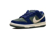 The Nike SB Dunk Low "Deep Royal Blue" is a colorway of the retro skateboarding shoe with a unique arrangement of colors and materials.  Perfect for skating or casual wear, the SB Dunk continues to be among the most popular shoes in the game.  The upper features a Vintage Green suede base and Deep Royal Blue suede overlays.  A Sail leather Swoosh is seen on both sides of the shoe, while white “Nike” branding is embroidered on the navy suede heel tab.  A “Nike SB Dunk” logo can be found on the to Royal Blue Shoes, Most Popular Shoes, Nike Branding, Nike Sb Dunk Low, Deep Royal Blue, Sb Dunk Low, Nike Sb Dunks Low, Popular Shoes, Nike Brand