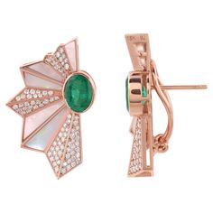 The focal point of these earrings is the magnificent Zambian Emeralds, renowned for their rich green hue and unparalleled beauty. These natural gems are meticulously selected for their exceptional quality, ensuring each earring exudes a mesmerizing vibrancy. Item Code :- SEE-15673 Gross Wt. :- 12.16 gm 18k Rose Gold Wt. :- 11.00 gm Natural Diamond Wt. :- 1.01 Ct. ( AVERAGE DIAMOND CLARITY SI1-SI2 & COLOR H-I ) Emerald & Mother of Pearl Wt. :- 4.79 Ct. Earrings Size :- 30 mm approx. ✦ Sizing .... Fine Studs, Japanese Fan, Multi Sapphire, Zambian Emerald, Fan Earrings, Gemstone Stud Earrings, Earrings Diamond, Rich Green, White Gold Jewelry