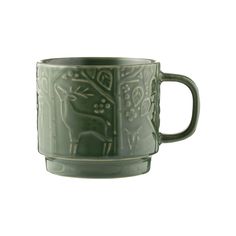 a green cup with designs on it