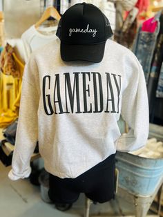 Unleash your game day style with our Gameday Sweatshirt! This cool grey crewneck features a bold black graphic, perfect for showing off your gameday spirit. The long sleeves keep you cozy while you cheer on your favorite team. This one pairs perfectly with our Gameday Cap. 100% Cotton Game Day Shirt Designs, Sweatshirt Cricut Ideas, Game Day Shirt Ideas, Gameday Sweatshirt, Aunt Stuff, Teach Sweatshirt, Fall Cricut, School Spirit Shirts Designs, 2023 Clothes