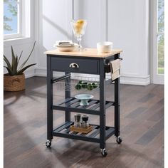 a kitchen cart with a wooden top on wheels