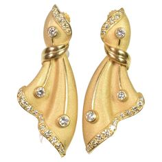 American, 2nd half-20th century. Each earring custom designed as a diamond set gold furled ribbon drop, hinged at top with screw back clips. Forty round diamonds, estimated total weight 1.60cts, clarity VS, color F/G. Very good condition. Overall length approx. 2", total weight 25.9gr. Jewelry Lookbook, Diamond Set, Gorgeous Jewelry, Screw Back Earrings, Round Diamonds, 20th Century, Screw, Jewelry Collection, Ribbon