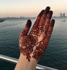 a hand that has some henna on it