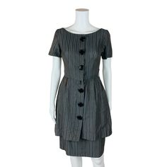 A vintage 1950s blue gray with brown striped button down wiggle dress with a wide boat neckline. Dress buttons up the front and has 2 snap button closures at the top, one inside the waist and a hook & eye closure. LABEL: Cluny Junior FABRIC: - SHOULDERS: 15" SHOULDER TO WAIST: 15" BUST: 36" WAIST: 25" HIPS: 36" LENGTH: 39" CONDITION: good, see photos- sold AS IS, discoloration on the back waist on the back of the skirt and below the waistline, loose threads on buttons, missing bottom button, mis 1950s Style Formal Dress With Button Closure, Elegant Vintage Dress With Button Closure For Work, 1950s Style Buttoned Dresses For Work, Striped Fitted Dress With Buttons, 1950s Vintage Dress With Buttons For Formal Occasions, Striped Fitted Dress With Button Closure, Fitted Striped Dress With Button Closure, Fitted Striped Dresses With Buttons, 1950s Style Formal Dresses With Buttons