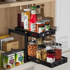 an organized spice rack in the kitchen with spices and condiments on it's shelf