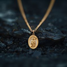 Experience the divine protection and guidance with our solid gold Santa muerte pendant. Expertly crafted in the USA, this exquisite piece honors the revered figure of Santa Muerte, celebrated for bestowing blessings and safekeeping. Made from premium solid gold, it showcases intricate detailing that brings the iconic imagery to life, making it a powerful symbol of faith and devotion. PENDANT INFORMATIONThis pendant is made of real, solid gold.• Made in USA• Material: 14k or 18k solid gold• Finish: polished• Height: 1.25" (31,5 mm) | *includes the small circle, bail dimensions not included• Width: 0.84" (21 mm)• Pendant weight: approx. 8 grams (14k)• Bail: fits up to 4 mm chains• Solid back, not hollow• A certificate of authenticity is included• Delivered in our elegant jewelry box, making Spiritual Yellow Gold-plated Necklaces, Yellow Gold Plated Spiritual Necklace, Spiritual Yellow Gold Plated Necklaces, Spiritual Yellow Gold Brass Jewelry, Bronze Tarnish Resistant Pendant Jewelry, Bronze Tarnish-resistant Pendant Jewelry, Spiritual Recycled Gold Round Pendant Jewelry, Spiritual Recycled Gold Pendant Jewelry, Gold Jewelry With Polished Oval Pendant