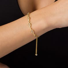 This 0.18 ct. t.w. diamond wave bolo bracelet is fashioned in 10K gold. The wheat chain secures with a bolo clasp that adjusts up to 9.5 inches in length. Gold Jewellery Women, Designer Gold Bracelet For Women, Bracelet Models Gold, Woman Gold Chain Designs, Gold Bracelets Design For Women, Loose Bracelets Diamond, Bracelet Designs Diamond, Ladies Bracelet Gold, Latest Bracelet Gold Women's