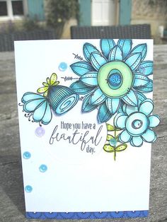 a card with blue flowers and butterflies on it