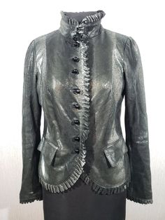 Stylish women's leather jacket of gray color. Noble leather jacket with decorative buttons. The gray women's jacket is made of durable soft genuine leather in various shades of gray. The jacket fastens with decorative plastic buttons in the form of black balls. At the bottom, the jacket has two convenient pockets with flaps. Decorative buttons on the cuffs of the jacket. The jacket has a nice polyester lining. The jacket is stylish, light and attractive. The jacket is suitable for both a busines Elegant Leather Jacket With Snap Buttons, Designer Fitted Leather Jacket With Buttons, Elegant Fitted Leather Jacket With Snap Buttons, Party Leather Outerwear With Button Closure, Leather Party Outerwear With Button Closure, Fall Party Leather Jacket With Buttons, Gray Leather Jacket For Fall, Womens Jackets, Shades Of Gray