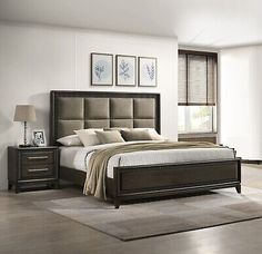 a bed room with a neatly made bed and two night stands on the side tables