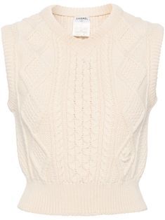 circa 1996 ivory white wool cable knit ribbed-knit edge V-neck sleeveless cropped straight hem Condition: GOOD. This previously owned and used item is in good condition with minimal signs of use. This may include fading of material or plating and scratches. Purchasing this item continues its narrative and reduces the environmental impact by avoiding the use of new resources needed to make the product from scratch, such as water, materials and electricity, and avoiding additional manufacturing impact. Learn more about what makes a product Conscious on our Conscious Criteria page Fitted White Cable Knit Sweater Vest, Fitted Cotton Cable Knit Sweater Vest, Fitted Beige Cable Knit Sweater Vest, Chanel Outfit, Shopping Chanel, Yoko London, City Dress, Wool Vest, Summer Beach Wear