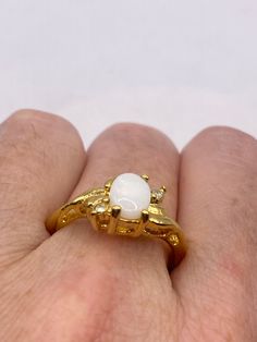 Vintage White Opal Wedding engagement Band 9k Gold Filled Ring Size 9  Our jeweler can re size this for a $20 fee All rings are shipped free in the US in a nice gift box.   Check out our over a THOUSAND great reviews Classic White Opal Ring With Birthstone, Classic White Opal Birthstone Ring, Gold Opal Birthstone Ring For Anniversary, Gold Opal Ring For Anniversary, Gold Round Opal Ring As Gift, Gold Opal Round Cut Ring For Anniversary, Elegant Gold Moonstone Ring With Center Stone, Gold Opal Ring For Anniversary With Round Cut, Gold Opal Ring For Gift