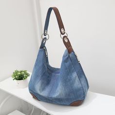 Brand Name: BottevenShape: Casual ToteHandbags Type: Shoulder BagsMain Material: DenimClosure Type: zipperHardness: SOFTExterior: Solid BagStyle: CasualLining Material: PolyesterOccasion: VersatileGender: WOMENPattern Type: SolidNumber of Handles/Straps: SingleInterior: Cell Phone PocketInterior: Interior Slot PocketInterior: Interior Zipper PocketDecoration: NONEItem Type: Handbags Jean Purses, Denim Handbags, Denim Purse, Denim Shoulder Bags, Jean Large, Denim Tote Bags, Denim Tote, Canvas Crossbody Bag, Large Handbags