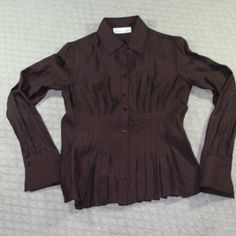 New Never Worn Cold Water Creek Button Up Top With A Ruched Front That Gives A Ruffled Bottom Illusion. Slightly Sheer With Almost A Metallic Sheen. The Cut Of This Top Is Fitted. It Is A Dark Chocolate Brown, Very Beautiful Color. New Without Tags Size: Petite Xsmall. Happy To Answer Questions, Bundle With Other Items To Save On Shipping And Take Reasonable Offers. New To Poshmark? Enter Code Style_exchange During Sign-Up To Get $10 Off Your First Order! The Actual Color Of The Item May Vary Sl Fitted V-neck Shirt With Button Cuffs, Elegant Brown Office Shirt, Fitted Brown Office Shirt, Brown Formal Top With Button Cuffs, Elegant Brown Button-up Shirt, Formal Brown Top With Button Cuffs, Fitted Brown Shirt For Office, Formal Brown Tops With Button Cuffs, Elegant Fitted Brown Shirt