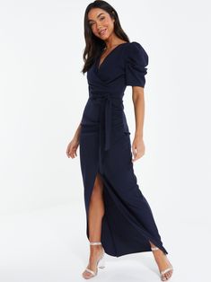 Make a statement in our Scuba Crepe Puff Sleeve Maxi Dress. Timeless navy color, dramatic puff sleeves, flowy maxi length. Dress it up or down! Model Is Wearing A Size 6 Runs Small, Please Size Up Wrap Skirt With Split Tie Wrap Belt At Waist Puff Sleeve Maxi Dress, Evening Dresses Online, Evening Dresses With Sleeves, Blue Evening Dresses, Empire Waist Dress, Maxi Dress Navy, Review Dresses, Sleeve Maxi Dress, Maxi Dress Blue