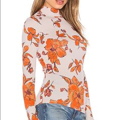 Bundles And Reasonable Offers Usually Accepted Trendy Floral Print Tops For Winter, Trendy Winter Floral Print Tops, Winter Stretch Floral Print Tops, Spring Orange Stretch Tops, Trendy Stretch Mock Neck Top For Spring, Casual White Mock Neck Top For Fall, Casual Mock Neck Top For Spring, Casual Turtleneck Tops For Spring, Spring Casual Stretch Mock Neck Top