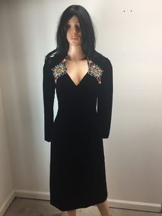 "Gorgeous vintage dress designed for Legends women's dress boutique in Roswell Georgia.  Tagged size 8, see measurements.  Black velvet embellished cocktail party dress with red, yellow, gold and green sequins and beads accenting the shoulder and neckline area.  Long sleeves (snaps at sleeve hem) and v neck style.  Back zipper closure.  In great vintage condition, see photos for more details.  Great holiday party dress or for New Years Eve party.   Length (shoulder to bottom hem): appx 42\" Pit Vintage V-neck Party Dress, Fitted V-neck Vintage Party Dress, Elegant Long Sleeve Vintage Dress For Party, Festive Fitted V-neck Evening Dress, Vintage V-neck Evening Dress For Formal Occasions, Elegant Fitted Vintage Party Dress, Elegant Fitted Vintage Dress For Party, Elegant Vintage V-neck Dress For Party, Elegant Vintage V-neck Party Dress