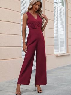 Be the star of the show in this stunning sleeveless wrap Neck Wide Leg Jumpsuit. This beautiful dress is crafted from a non-stretch woven fabric, made from polyester for comfort and durability. The flattering v-neckline and high waist silhouette add drama, while the regular fit flatters your curves. The perfect dress for the summer months, you'll be sure to make a statement. Specifications: Details: Wrap Fit Type: Regular Fit Neckline: V neck Sleeve Length: Sleeveless Waist Line: High Waist Fabric: Non-Stretch Material: Woven Fabric Composition: 100% Polyester Care Instructions: Machine wash or professional dry clean Product Measurements(cm): Size US Bust Hip Size Inseam Length Shoulder Thigh Waist Size S 4 92 104 70 145 35 66 74 M 6 96 108 70.5 147 36 68.4 78 L 8/10 102 114 71.3 149.5 37. Jumpsuit Navy Blue, Comfy Jumpsuits, Wrap Jumpsuit, Neck Wrap, Summer Months, Wide Leg Jumpsuit, Beautiful Dress, The Star, Wrap Style