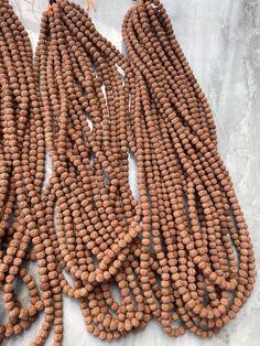 Welcome, Namaste  Natural 6 mm Rudraksha beads Size Of Beads : 6 mm Number Of Beads : Variation of ( 101, 501, 1101) beads as per your requirement Wholesale Price 100% Original & Authentic ORIGIN :: Java indonesia Bohemian 8mm Beads For Puja, Polished Round Beaded Necklace For Puja, Polished Beaded Necklaces For Puja, Hand-strung Beads For Jewelry Making And Festivals, Round Polished Beaded Necklaces For Puja, Festival Mala With Polished Round Beads, Festival Mala With Polished Beads, Hand-strung Beads For Puja, Festival Mala With Large Round Beads