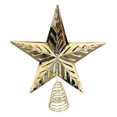 a gold star ornament hanging on a white wall with a spiral christmas tree topper