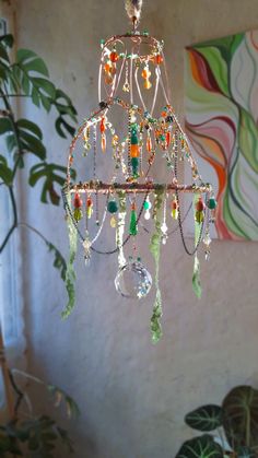 Introducing an exquisite boho wall hanging, a truly unique wedding gift that is perfect for newlywed couples.  This intricately crafted piece will add a touch of boho charm to any home decor. Handmade with love, this chandelier is one-of-a-kind, making it a special and thoughtful present for the newlyweds.  The beautiful combination of vibrant colors and delicate details creates a truly stunning and eye-catching piece.  Surprise the happy couple with this extraordinary and unique gift that will Beaded Wall Hanging, Diy Lamps, Boho Chandelier, Chandelier Art, Newly Wed, Wedding 2025, Boho Wall Hanging, Unique Wedding Gifts, Wedding Crafts