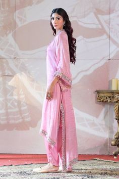 Pink kaftan high low kaftan kurta with mirror embroidery and tassel details. Paired with an inner and dhoti pant. - Aza Fashions Wedding Chanderi Kaftan With Mirror Work, Tissue Silk Kurta With Mirror Work In Traditional Drape, Unstitched Kaftan With Mirror Work For Wedding, Unstitched Kaftan With Mirror Work For Navratri, Traditional Drape Tissue Silk Kurta With Mirror Work, Eid Cotton Silk Palazzo Set With Traditional Drape, Traditional Drape Pink Palazzo Set With Dabka, Bollywood Style Dabka Palazzo Set In Slub Silk, Saree-shaped Kaftan With Mirror Work For Wedding