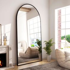 a living room with a fireplace and large mirror